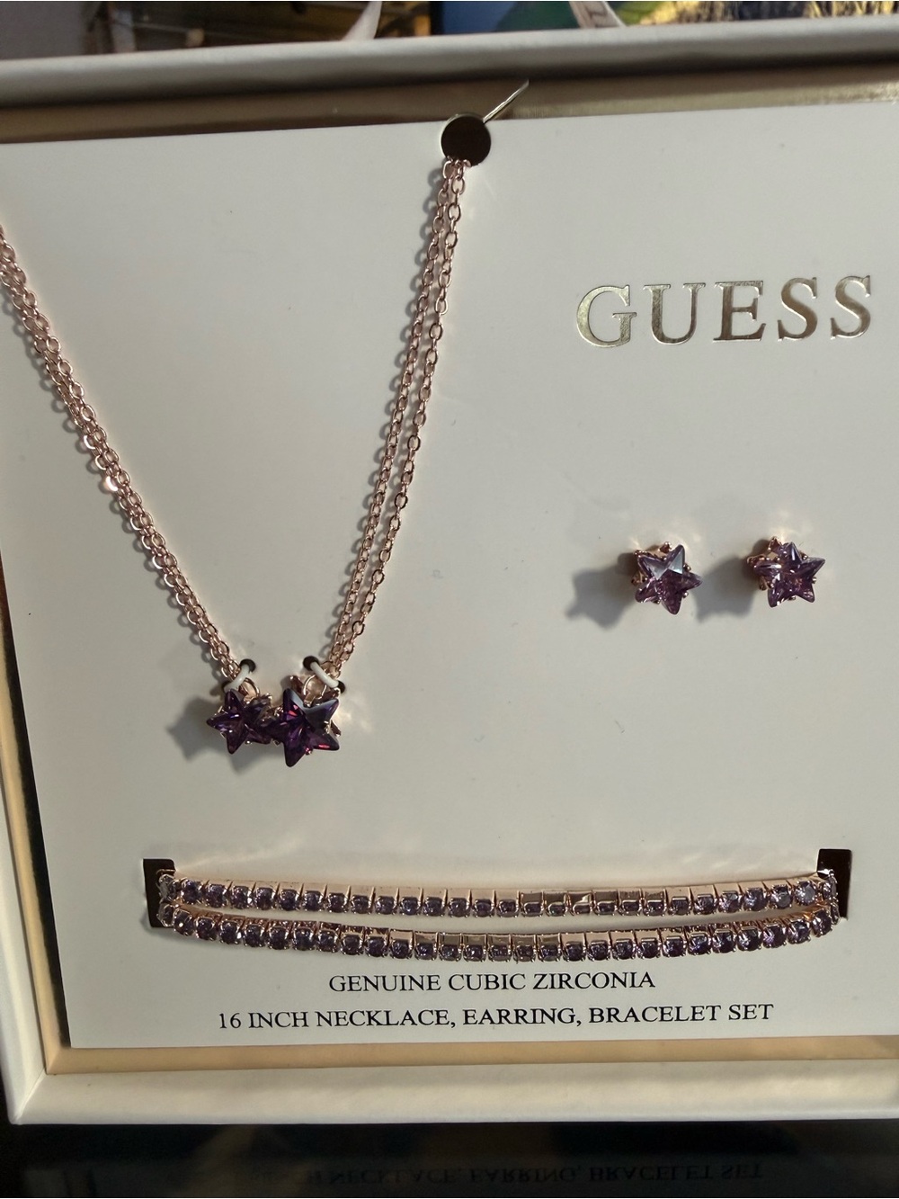 NWT Guess 16ā Necklace with purple stone rose gold plated.